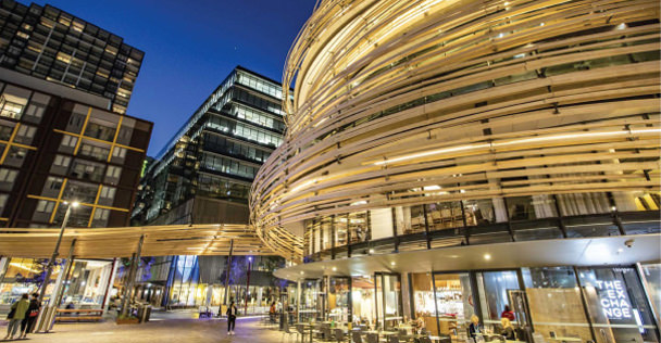 Exterior photo of the entrace to the Exchange building at Darling Square at night